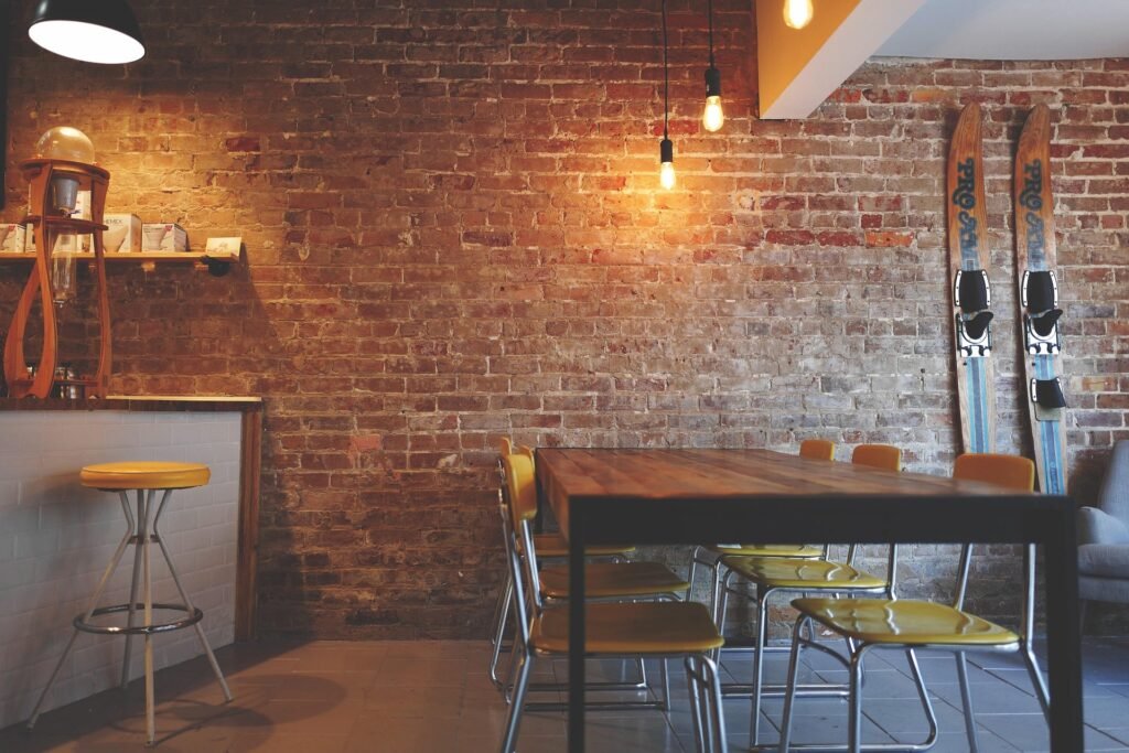 Restaurant interior with red brick and a table